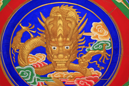 dragon head sculpture color drawing and pattern, closeup of photoの写真素材
