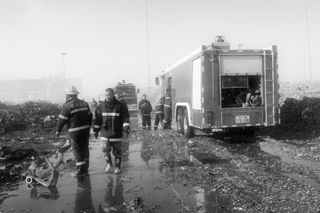 TANGSHAN - NOVEMBER 20: The prepare to leave the scene of the fire fighting vehicles and personnel after the fire, November 20, 2013, tangshan city, hebei province, China.のeditorial素材
