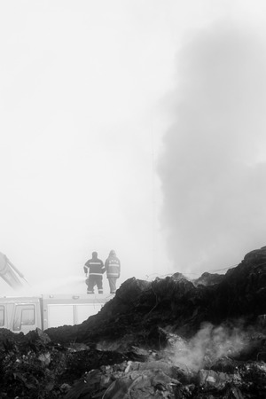 TANGSHAN - NOVEMBER 20: firefighters in sprinkler at the scene of the fire, November 20, 2013, tangshan city, hebei province, China.のeditorial素材