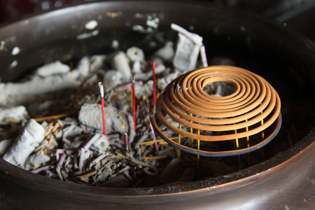 incense burner in a temple, closeup of photoの写真素材