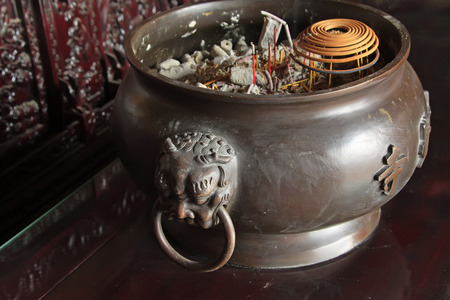 incense burner in a temple, closeup of photoの写真素材