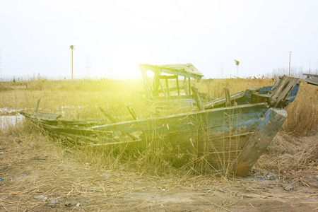 Wooden fishing boat wreckage, closeup of photoの写真素材