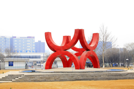 LANGFANG CITY - MARCH 12: Red sculpture in the square of ENN Group, March 12, 2015, Langfang City, Hebei Province, China.のeditorial素材