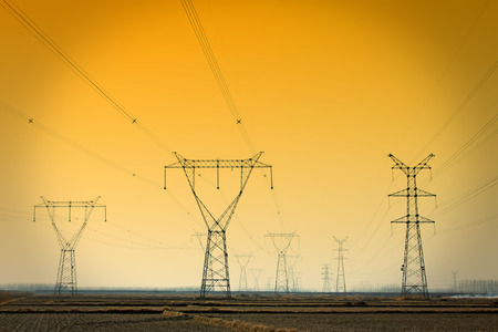Electric power tower under the blue sky, closeup of photo
