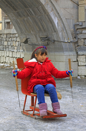 LUAN COUNTY - JANUARY 10: girl skating on the ice on January 10, 2015, Hebei Province, Luan County, Chinaのeditorial素材