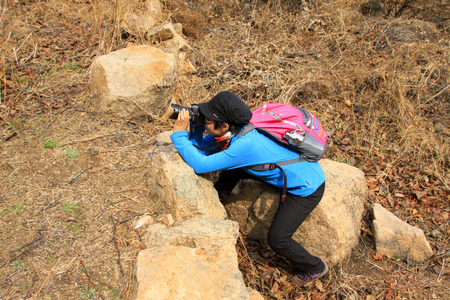 Pinggu county - April 4: mountain outdoor travelers taking photoes, on April 4, 2015, Beijing, Chinaのeditorial素材