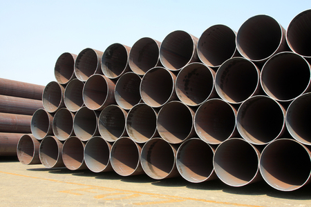 Piles of steel pipe, closeup of photo