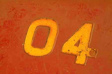 brown number on the plate, closeup of photo