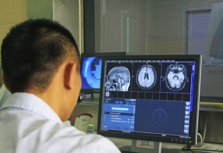 Luannan - June 18: doctor diagnosis using a computer in the hospital, June 18, 2015, luannan county, hebei province, Chinaのeditorial素材