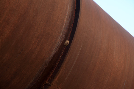 idle cement plant rotary kiln machinery main structure, closeup of photoの写真素材