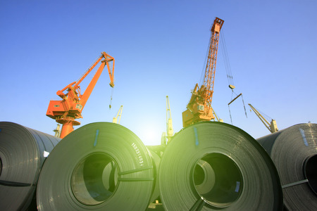 strip steel and crane in bulk terminal, closeup of photoのeditorial素材