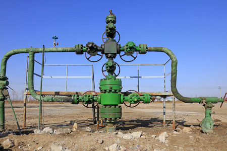 Oil pipeline on the ground, closeup of photo