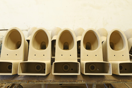 toilet unpainted clay idol in production workshopの写真素材