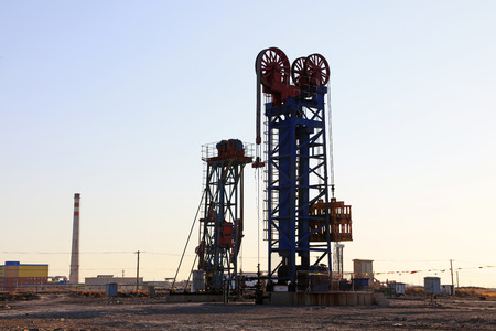 Tower type pumping unit under the setting sun in a oilfieldのeditorial素材