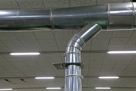Stainless steel pipe in the factory, closeup of photo