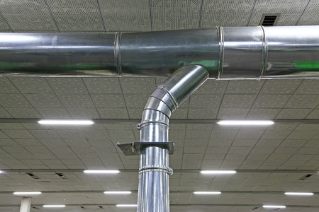 Stainless steel pipe in the factory, closeup of photo