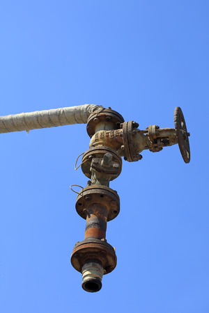 Piping and valves under blue skyのeditorial素材