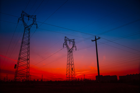 Electric power tower under the setting sun