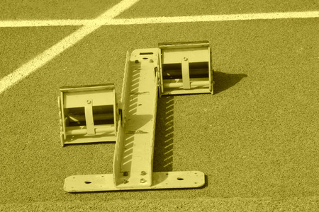 run up ware on red plastic runway in a sports ground in a middle school