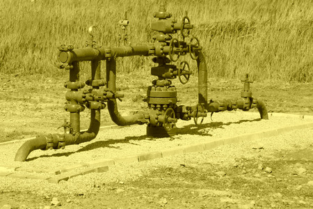 green petroleum machinery and red handwheel, closeup of photoのeditorial素材