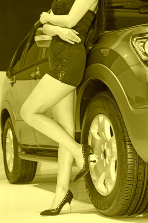 wheel and sexy high heels, closeup of photoのeditorial素材