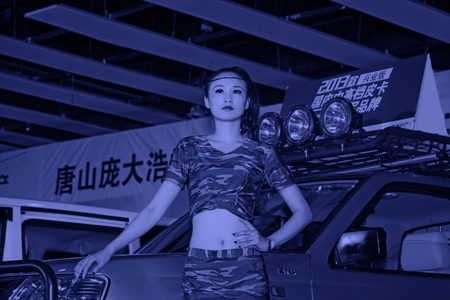 TANGSHAN - MAY 31: Beauty model in a car market on may 31, 2014, Tangshan city, Hebei Province, Chinaのeditorial素材