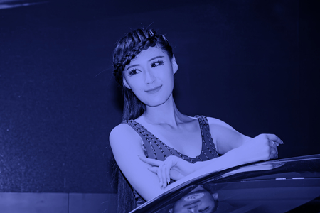 TANGSHAN - MAY 31: Beauty model in a car markets on may 31, 2014, Tangshan city, Hebei Province, Chinaのeditorial素材
