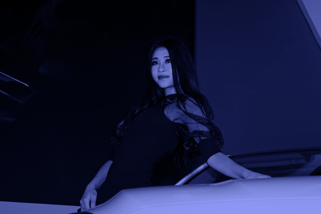 TANGSHAN - MAY 31: Beauty model in a car markets on may 31, 2014, Tangshan city, Hebei Province, Chinaのeditorial素材