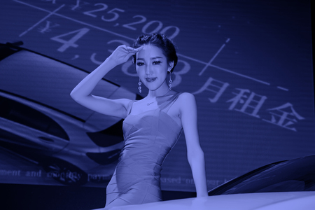 TANGSHAN - MAY 31: Beauty model in a car marketsï¼on may 31, 2014, Tangshan city, Hebei Province, Chinaのeditorial素材