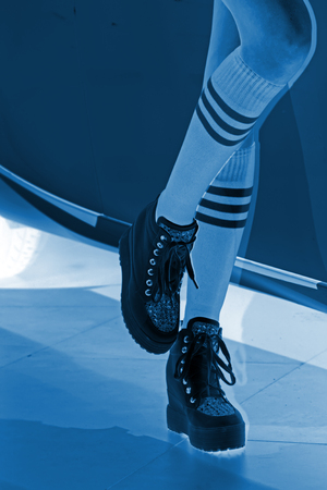 Sportswear green socks white shoes, closeup of photoのeditorial素材