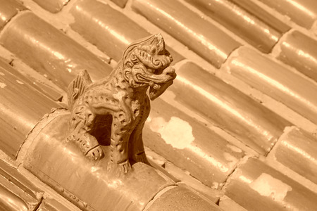 Chinese traditional style yellow glazed tile roof, closeup of photoの写真素材
