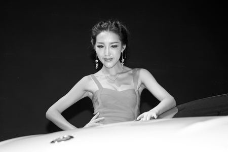 TANGSHAN - MAY 31: Beauty model in a car marketsï¼on may 31, 2014, Tangshan city, Hebei Province, Chinaのeditorial素材