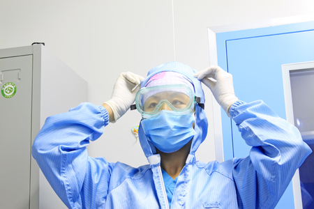 Luannan County - June 18th: a doctor finishing clothing, June 18th, 2015, Luannan County, Hebei Province, Chinaのeditorial素材