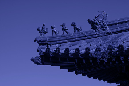 traditional Chinese style yellow glazed tile roof and benevolent, closeup of photoの写真素材