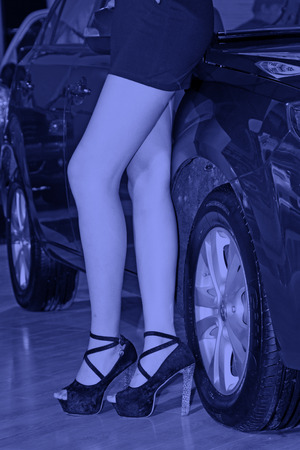 wheel and sexy high heels, closeup of photoのeditorial素材