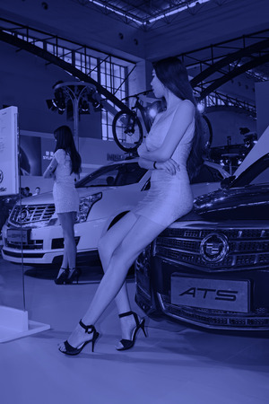 TANGSHAN - MAY 31: Beauty model in a car marketsï¼on may 31, 2014, Tangshan city, Hebei Province, Chinaのeditorial素材