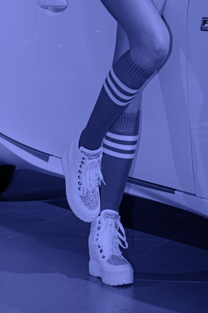 Sportswear green socks white shoes, closeup of photoのeditorial素材