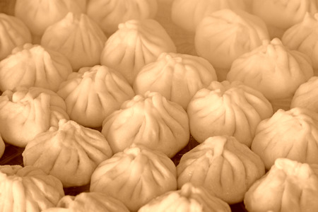 steamed stuffed bun in the dish on the white backgroundの写真素材