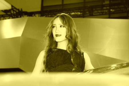 TANGSHAN - MAY 31: Beauty model in a car marketsï¼on may 31, 2014, Tangshan city, Hebei Province, Chinaのeditorial素材