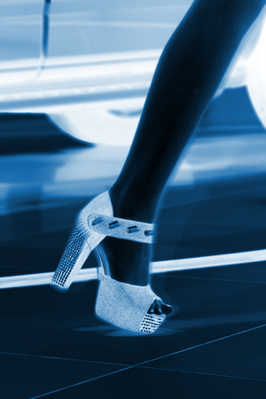 Beauty model dressed in black high heels, closeup of photoの写真素材