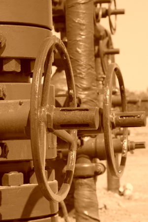 green petroleum machinery and red handwheel, closeup of photoの写真素材