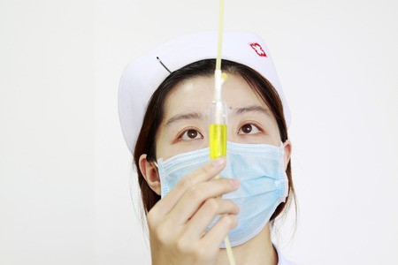 Luannan - June 29: nurse check infusion tube in the hospital, on June 29, 2015, luannan county,...