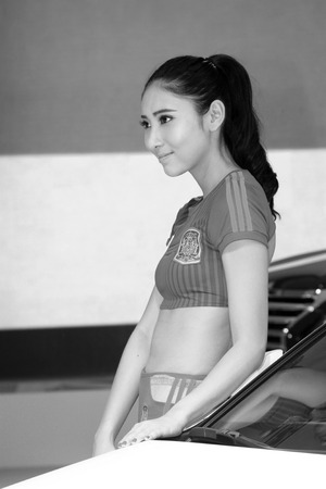 TANGSHAN - MAY 31: Beauty model in a car markets on may 31, 2014, Tangshan city, Hebei Province, Chinaのeditorial素材
