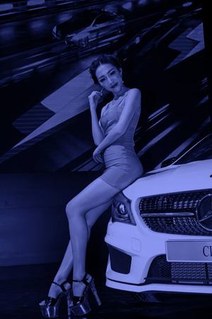 TANGSHAN - MAY 31: Beauty model in a car markets on may 31, 2014, Tangshan city, Hebei Province,...