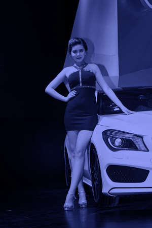 TANGSHAN - MAY 31: Beauty model in a car markets on may 31, 2014, Tangshan city, Hebei Province, Chinaのeditorial素材