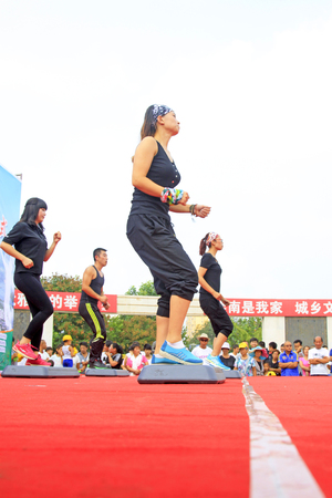 Luannan County - August 7: Step aerobics performances on the stage, on August 7, 2015, luannan county, hebei province, China