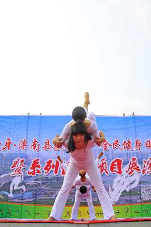 Luannan County - August 7: Yoga performance on the stage, on August 7, 2015, luannan county, hebei province, Chinaのeditorial素材