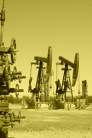 CAOFEIDIAN - MAY 2: crank balanced beam pumping unit in the JiDong oilfield, on may 2, 2014, caofeidian, hebei province, China.のeditorial素材