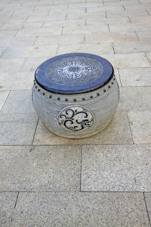 drum-shaped stone blocks on the ground
