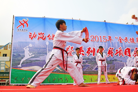Luannan County - August 7: taekwondo performance on the stage, on August 7, 2015, luannan county, hebei province, Chinaのeditorial素材